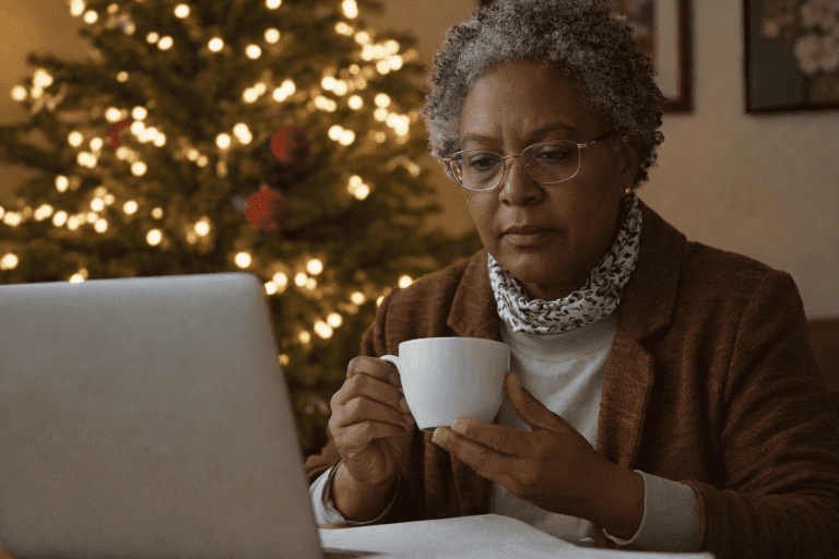Senior woman creating holiday budget tips at home